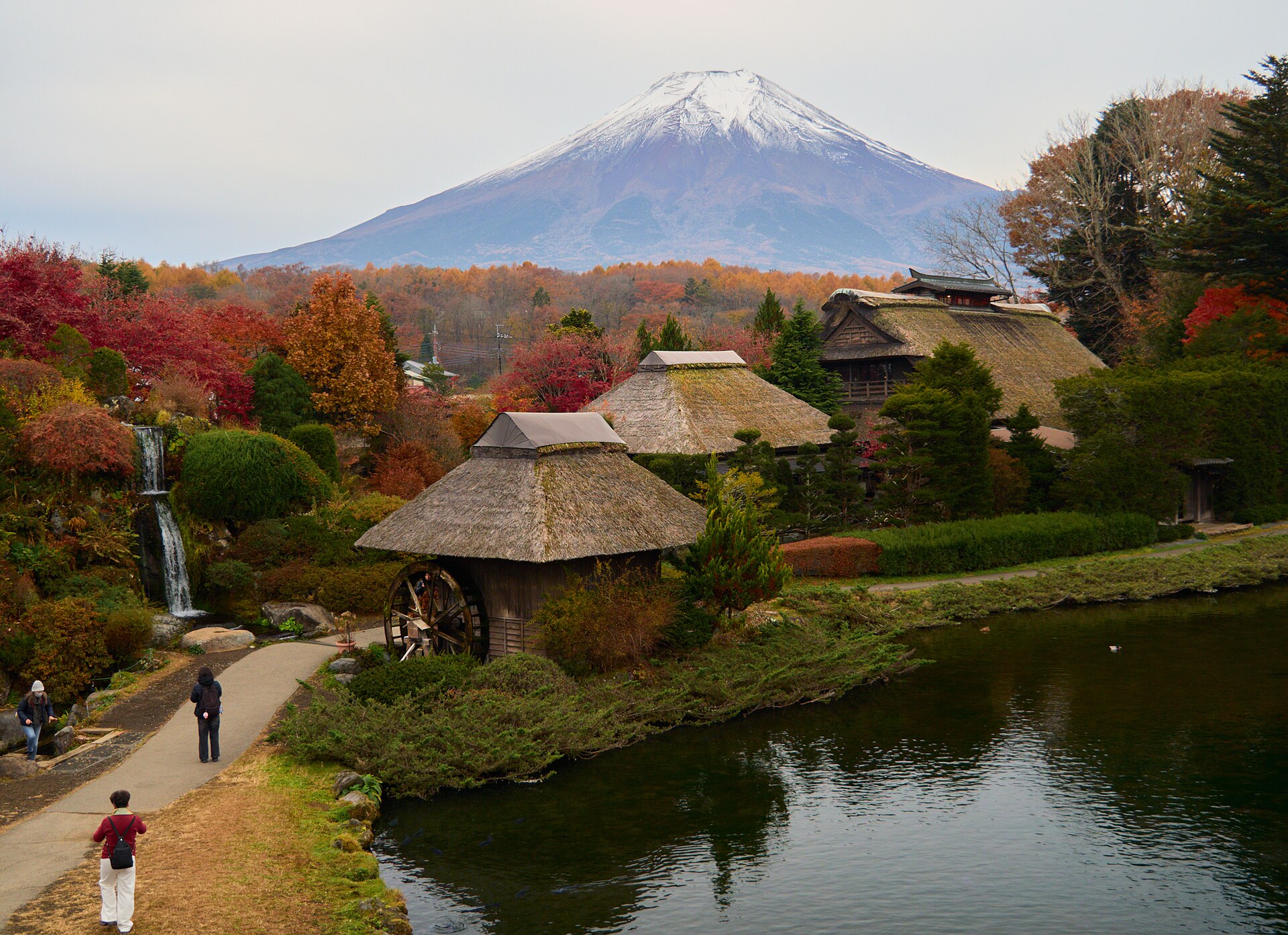 Thatched houses and clear ponds at Oshino Hakkai with Mt Fuji behind